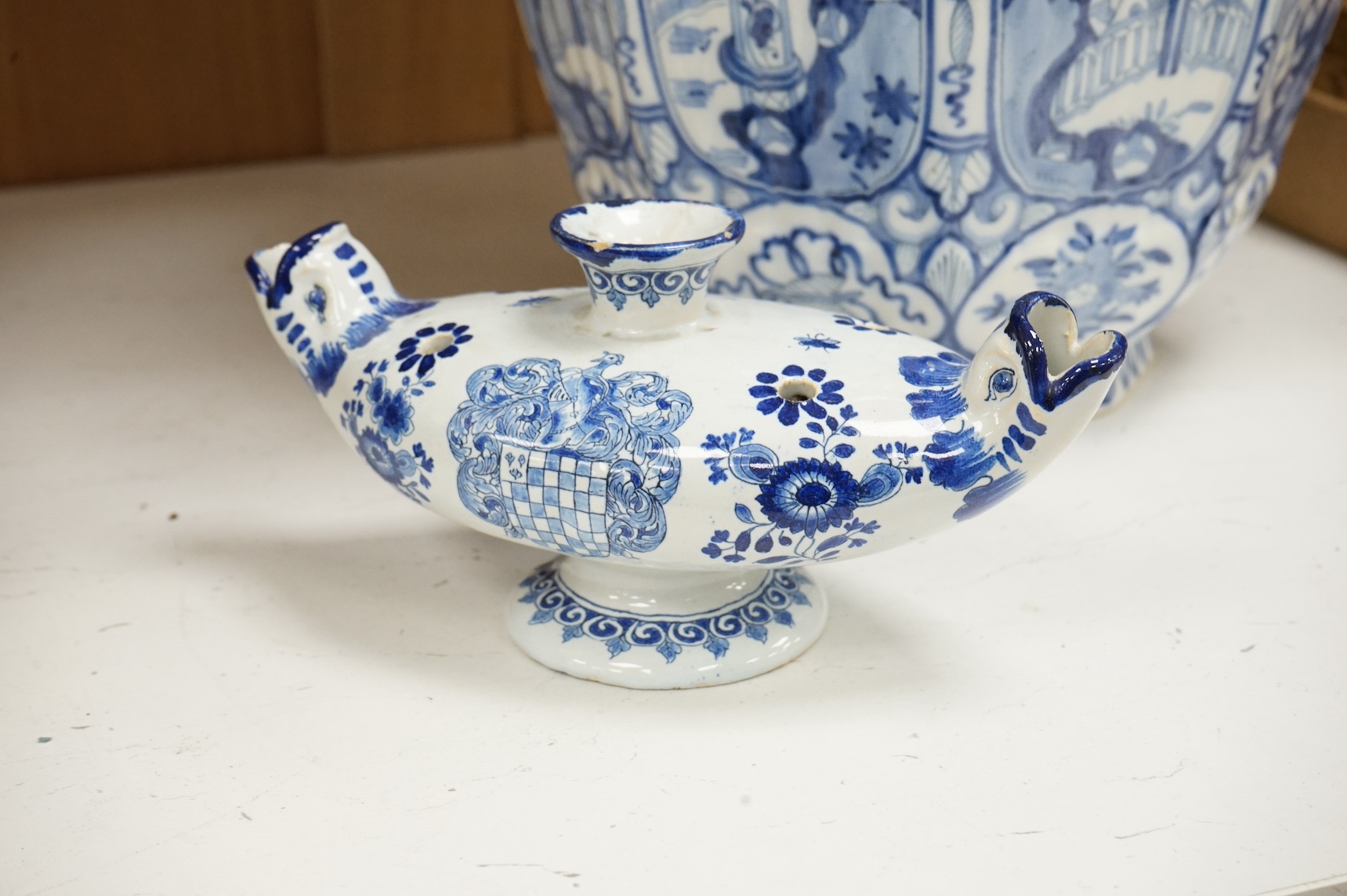 A blue and white delft jar in a chinoiserie style, and a delftware posy vase, tallest 34cm. Condition - fair to good